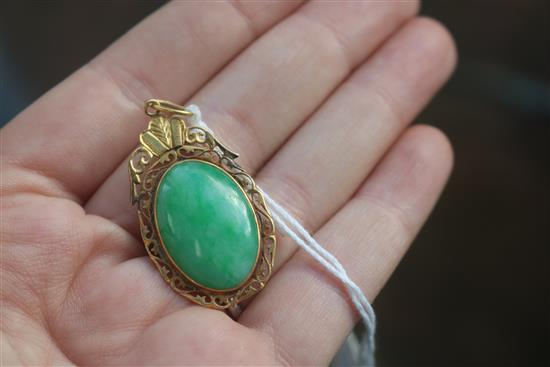 A Chinese gold framed jade pendant, in a Tessier box